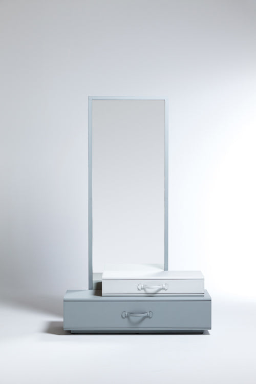 Mirror with suitcase